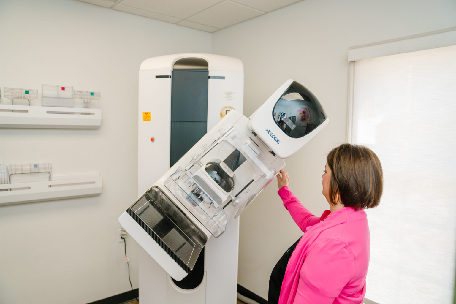 A member of the Oxford OBGYN team positioning the practice's digital mammography unit